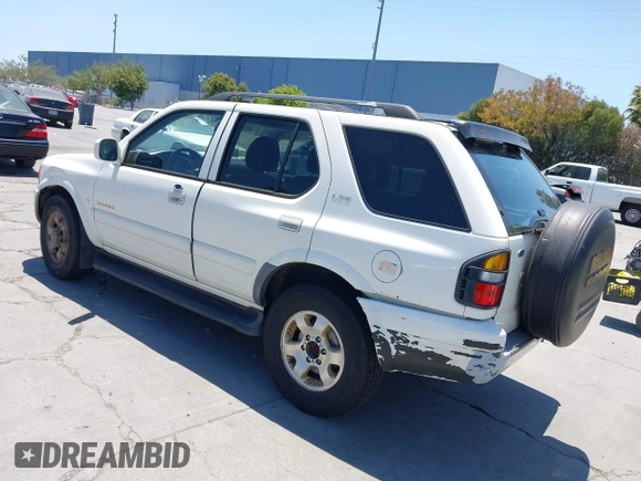 1999 Isuzu Rodeo S with VIN 4S2CK58W1X4344442, listed as a IAAI auction lot 42519582 with 185,098 mi miles and . Bid and sale history available at DreamBid. Image 3.