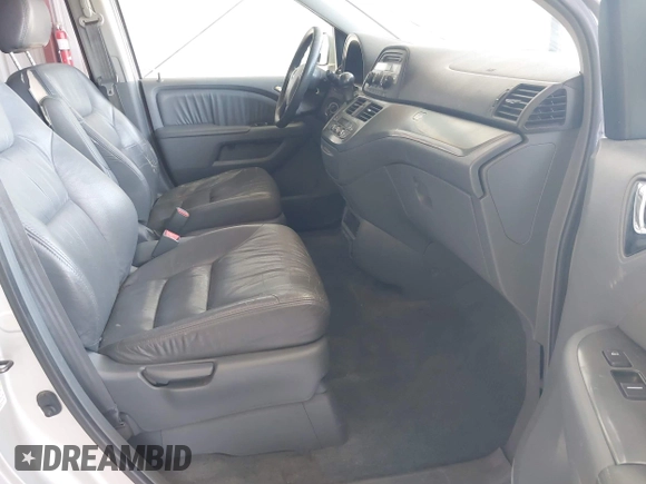 2005 Honda Odyssey EX-L with VIN 5FNRL38705B106488, listed as a IAAI auction lot 42545141 with 199,619 mi miles and . Bid and sale history available at DreamBid. Image 5.