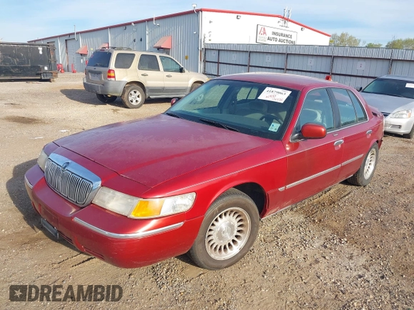 2000 Mercury Grand Marquis LS z VIN 2MEFM75W1YX736283, wystawiony jako IAAI lot #41879063 z przebiegiem 114 535 mil mil oraz . Historia ofert i sprzedaży dostępna na DreamBid. Obrazek 2.