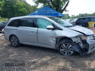 2014 Honda Odyssey Touring with VIN 5FNRL5H97EB054158, listed as a IAAI auction lot 42548360 with 91,161 mi miles and . Bid and sale history available at DreamBid. Image 13.
