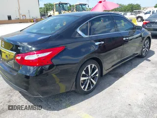 2016 Nissan Altima SR with VIN 1N4AL3AP4GC289147, listed as a IAAI auction lot 42159067 with 105,112 mi miles and . Bid and sale history available at carsss.com. Image 4.