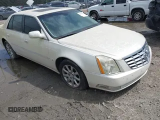 2008 Cadillac DTS 1SD z VIN 1G6KD57Y28U112764, wystawiony jako IAAI lot #41953240 z przebiegiem Nie podano mil oraz . Historia ofert i sprzedaży dostępna na DreamBid. Obrazek 1.