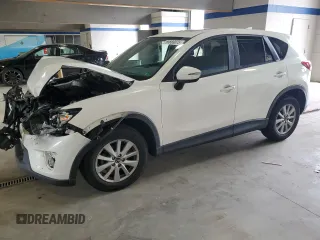 2016 Mazda CX-5 Touring z VIN JM3KE4CY8G0893152, wystawiony jako Copart lot #55666075 z przebiegiem 69 433 mil mil oraz Szkoda całkowita • Salvage title. Historia ofert i sprzedaży dostępna na DreamBid. Obrazek 1.