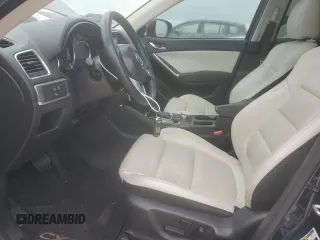 2016 Mazda CX-5 Grand Touring with VIN JM3KE2DY7G0920506, listed as a Copart auction lot 52866254 with 122,615 mi miles and Clean Title. Bid and sale history available at carsss.com. Image 7.
