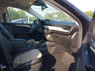 2021 Ford Escape Titanium Hybrid with VIN 1FMCU9DZ0MUB14833, listed as a IAAI auction lot 42593983 with 51,852 mi miles and . Bid and sale history available at DreamBid. Image 5.