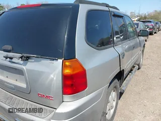 2004 GMC Envoy SLE with VIN 1GKDT13S042113411, listed as a IAAI auction lot 42117824 with 116,827 mi miles. Bid and sale history available at carsss.com. Image 4.