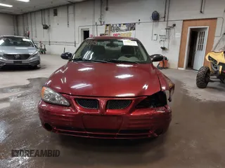 2002 Pontiac Grand Am SE z VIN 1G2NE52F92C291335, wystawiony jako IAAI lot #41665150 z przebiegiem 75 552 mil mil oraz . Historia ofert i sprzedaży dostępna na DreamBid. Obrazek 13.