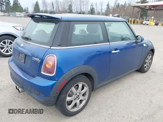 2007 MINI Hardtop S with VIN WMWMF73527TL91061, listed as a IAAI auction lot 41842104 with 65,259 mi miles and . Bid and sale history available at DreamBid. Image 4.