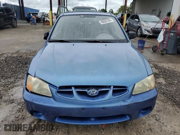 2001 Hyundai Accent z VIN KMHCF35G11U112976, wystawiony jako Copart lot #68692384 z przebiegiem 152 797 mil mil oraz Szkoda całkowita • Salvage title. Historia ofert i sprzedaży dostępna na DreamBid. Obrazek 5.