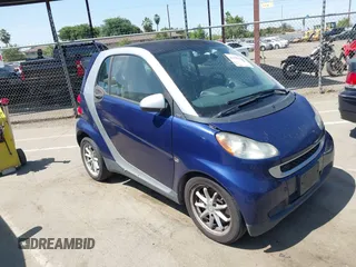2008 Smart fortwo Pure z VIN WMEEJ31X38K195867, wystawiony jako IAAI lot #42596180 z przebiegiem 53 634 mil mil oraz . Historia ofert i sprzedaży dostępna na DreamBid. Obrazek 1.