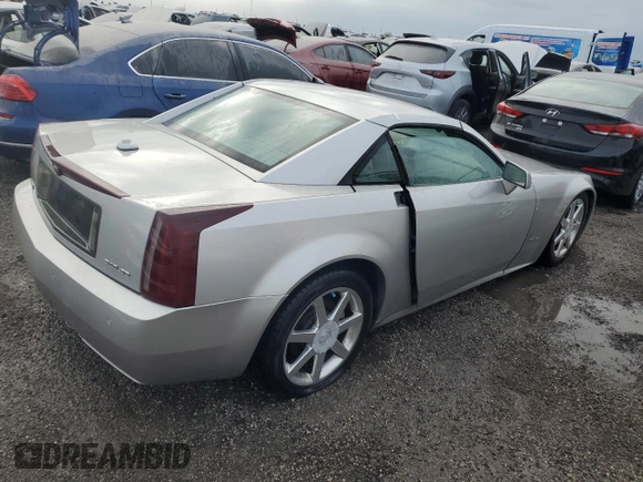 2004 Cadillac XLR z VIN 1G6YV34A545602056, wystawiony jako Copart lot #66506514 z przebiegiem Nie podano mil oraz Nie do naprawy • Non repairable. Historia ofert i sprzedaży dostępna na DreamBid. Obrazek 3.