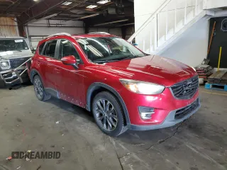 2016 Mazda CX-5 Grand Touring with VIN JM3KE4DY1G0669316, listed as a Copart auction lot 79961554 with 117,454 mi miles and Salvage Title. Bid and sale history available at carsss.com. Image 4.