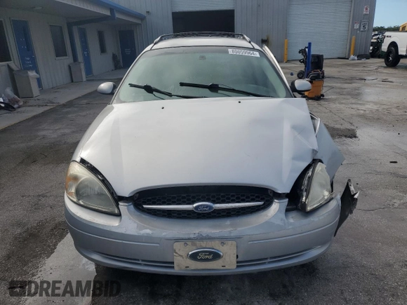 2003 Ford Taurus z VIN 1FAHP59U73A217826, wystawiony jako Copart lot #80059964 z przebiegiem 315 560 mil mil oraz Szkody całkowita. Historia ofert i sprzedaży dostępna na DreamBid. Obrazek 5.