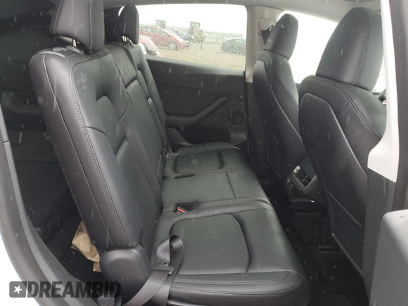 2023 Tesla Model Y Long Range z VIN 7SAYGAEE0PF693613, wystawiony jako Copart lot #54452895 z przebiegiem 19 574 mil mil oraz Szkoda całkowita • Salvage title. Historia ofert i sprzedaży dostępna na DreamBid. Obrazek 10.