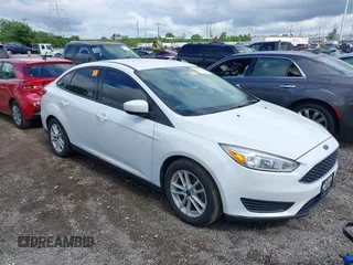 2018 Ford Focus SE z VIN 1FADP3F29JL280420, wystawiony jako IAAI lot #39526345 z przebiegiem 113 055 mil mil oraz . Historia ofert i sprzedaży dostępna na DreamBid. Obrazek 1.