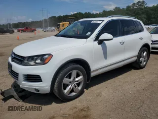 2014 Volkswagen Touareg Lux with VIN WVGEF9BP2ED013735, listed as a Copart auction lot 62924835 with 126,959 mi miles and Salvage title. Bid and sale history available at DreamBid. Image 1.