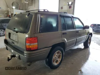 1998 Jeep Grand Cherokee Limited with VIN 1J4GZ78Y8WC285670, listed as a Copart auction lot 70213044 with 128,382 mi miles and Clean Title. Bid and sale history available at carsss.com. Image 3.