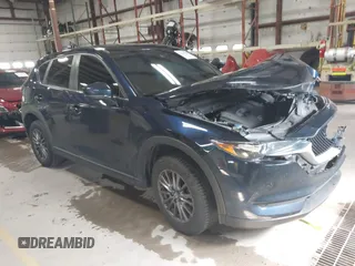 2020 Mazda CX-5 Touring with VIN JM3KFBCM6L0739077, listed as a IAAI auction lot 41810946 with 82,911 mi miles and . Bid and sale history available at carsss.com. Image 1.