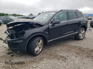 2013 Volkswagen Touareg Sport with VIN WVGEP9BP1DD007212, listed as a Copart auction lot 61451145 with 200,699 mi miles and Clean title. Bid and sale history available at DreamBid. Image 1.