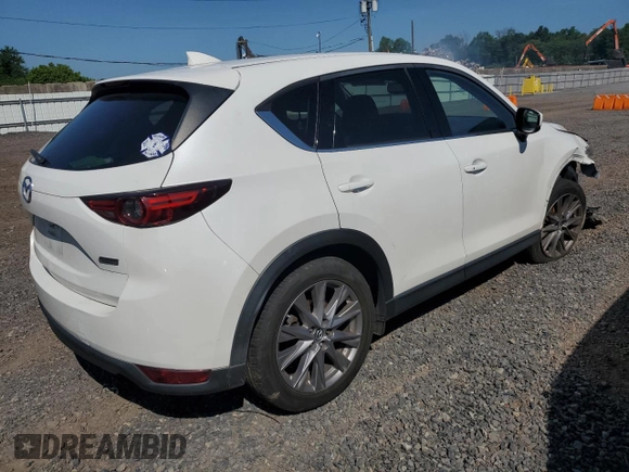 2019 Mazda CX-5 Grand Touring with VIN JM3KFBDM2K1663140, listed as a Copart auction lot 61713755 with 68,101 mi miles and Salvage title. Bid and sale history available at DreamBid. Image 3.