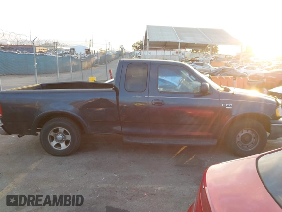1999 Ford F-150 XL with VIN 1FTRX17L3XKB32547, listed as a IAAI auction lot 41331882 with Not Provided miles. Bid and sale history available at carsss.com. Image 13.