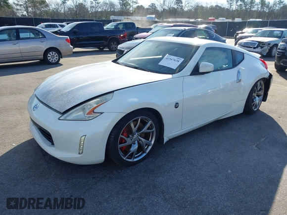 2013 Nissan 370Z z VIN JN1AZ4EH4DM380820, wystawiony jako IAAI lot #41547638 z przebiegiem 118 222 mil mil oraz . Historia ofert i sprzedaży dostępna na DreamBid. Obrazek 17.