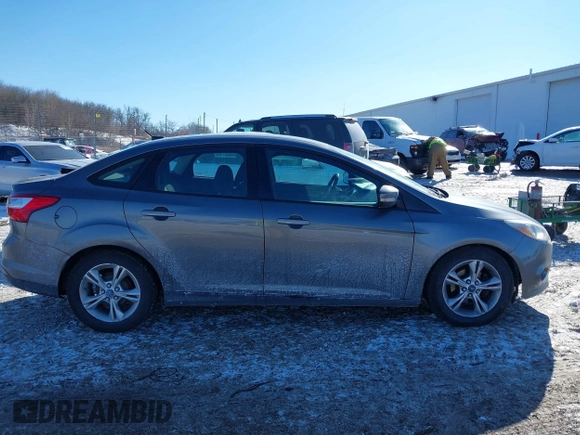 2013 Ford Focus SE z VIN 1FADP3F28DL206541, wystawiony jako IAAI lot #41639697 z przebiegiem 109 828 mil mil oraz . Historia ofert i sprzedaży dostępna na DreamBid. Obrazek 13.
