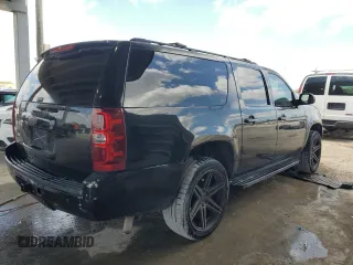 2013 Chevrolet Suburban LT with VIN 1GNSCJE00DR300449, listed as a Copart auction lot 55134455 with 301,552 mi miles and Salvage title. Bid and sale history available at DreamBid. Image 3.