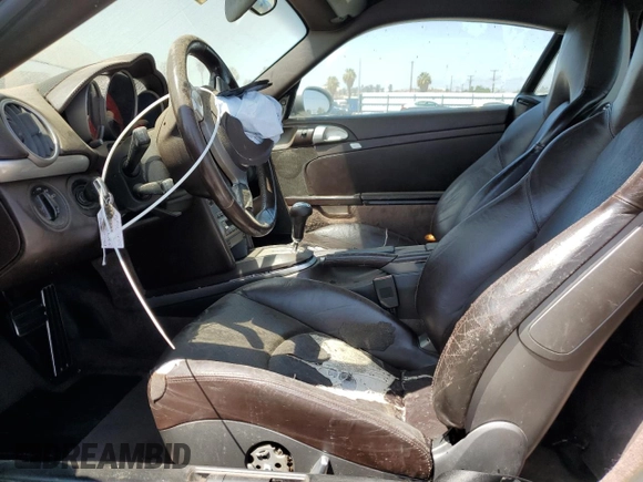 2006 Porsche Cayman S с VIN WP0AB298X6U784563, выставлен на аукционе Copart как лот 69819084 с пробегом 132 131 миль миль и Списание • Salvage title. История ставок и продаж доступна на DreamBid. Изображение 7.
