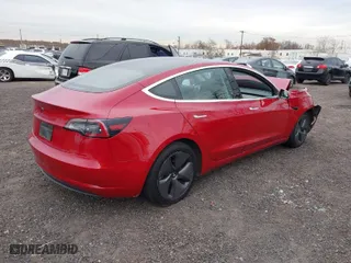 2018 Tesla Model 3 Long Range Battery with VIN 5YJ3E1EA4JF159743, listed as a IAAI auction lot 40839991 with 117,039 mi miles. Bid and sale history available at carsss.com. Image 4.