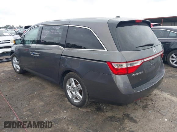 2012 Honda Odyssey Touring with VIN 5FNRL5H99CB071010, listed as a IAAI auction lot 41651233 with 186,913 mi miles. Bid and sale history available at carsss.com. Image 3.