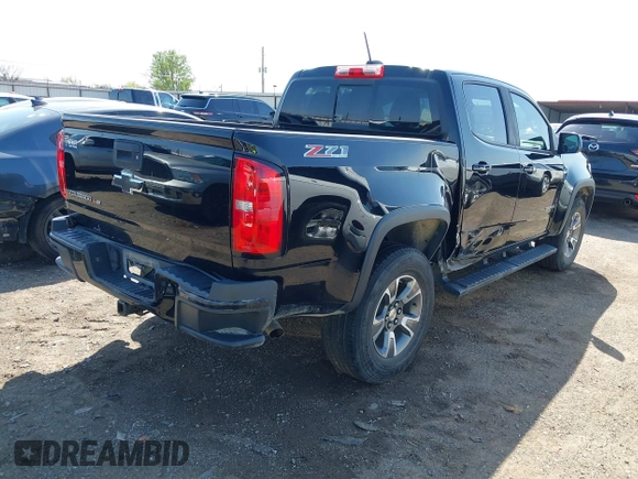 2018 Chevrolet Colorado 4WD Z71 z VIN 1GCGTDEN0J1173420, wystawiony jako IAAI lot #41971813 z przebiegiem 98 499 mil mil oraz . Historia ofert i sprzedaży dostępna na DreamBid. Obrazek 4.