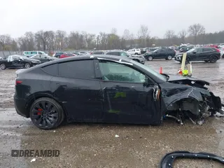 2023 Tesla Model Y Performance z VIN 7SAYGDEF0PF715703, wystawiony jako IAAI lot #41869780 z przebiegiem 32 220 mil mil oraz . Historia ofert i sprzedaży dostępna na DreamBid. Obrazek 12.