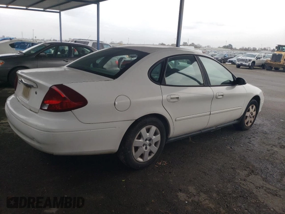 2003 Ford Taurus LX Standard with VIN 1FAFP52U53G280700, listed as a Copart auction lot 87488014 with 128,020 mi miles and Salvage title. Bid and sale history available at DreamBid. Image 3.