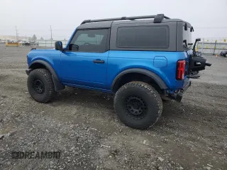 2023 Ford Bronco with VIN 1FMDE5AHXPLB26651, listed as a Copart auction lot 77497964 with 19,700 mi miles and Salvage Title. Bid and sale history available at carsss.com. Image 2.