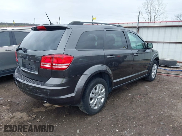 2017 Dodge Journey SE with VIN 3C4PDCAB9HT603595, listed as a IAAI auction lot 41914690 with 104,960 mi miles and . Bid and sale history available at DreamBid. Image 4.