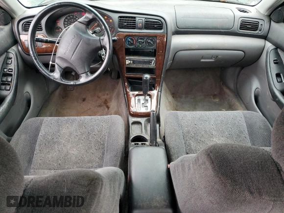 2000 Subaru Legacy with VIN 4S3BE6453Y7215569, listed as a Copart auction lot 81493564 with 218,045 mi miles and Salvage title. Bid and sale history available at DreamBid. Image 8.