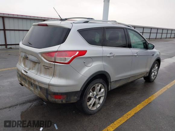 2015 Ford Escape Titanium with VIN 1FMCU9J97FUA84589, listed as a IAAI auction lot 41688156 with 129,073 mi miles. Bid and sale history available at carsss.com. Image 4.