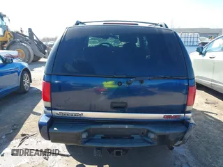 1999 GMC Jimmy SLE with VIN 1GKDT13W3X2553792, listed as a IAAI auction lot 41876489 with 266,884 mi miles. Bid and sale history available at carsss.com. Image 17.