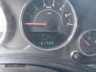 2014 Jeep Wrangler Unlimited Sahara with VIN 1C4BJWEG6EL217945, listed as a IAAI auction lot 42388477 with 61,739 mi miles and . Bid and sale history available at DreamBid. Image 7.