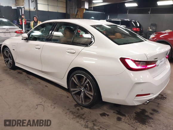 2023 BMW 3 Series 330e xDrive with VIN 3MW39FS05P8D20575, listed as a IAAI auction lot 42076033 with 10,875 mi miles. Bid and sale history available at carsss.com. Image 3.