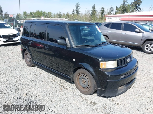 2005 Scion xB with VIN JTLKT334454021261, listed as a IAAI auction lot 42124927 with 221,043 mi miles. Bid and sale history available at carsss.com. Image 1.