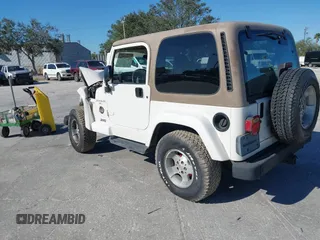 2001 Jeep Wrangler Sahara with VIN 1J4FA59S51P332107, listed as a IAAI auction lot 40954726 with 150,671 mi miles. Bid and sale history available at carsss.com. Image 3.