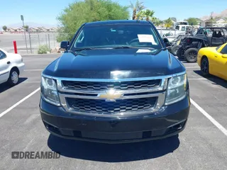 2015 Chevrolet Tahoe Commercial z VIN 1GNLC2EC0FR629983, wystawiony jako IAAI lot #42825604 z przebiegiem 112 410 mil mil oraz . Historia ofert i sprzedaży dostępna na DreamBid. Obrazek 6.