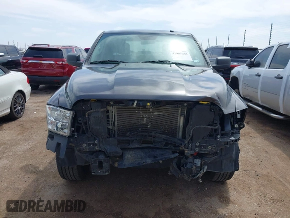2021 Ram 1500 Tradesman z VIN 3C6RR6KG9MG563230, wystawiony jako IAAI lot #41905688 z przebiegiem 81 143 mil mil oraz . Historia ofert i sprzedaży dostępna na DreamBid. Obrazek 13.