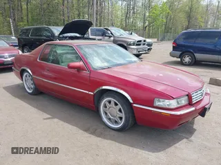 1997 Cadillac Eldorado Touring ETC z VIN 1G6ET1297VU600449, wystawiony jako IAAI lot #42096992 z przebiegiem 185 918 mil mil oraz . Historia ofert i sprzedaży dostępna na DreamBid. Obrazek 1.