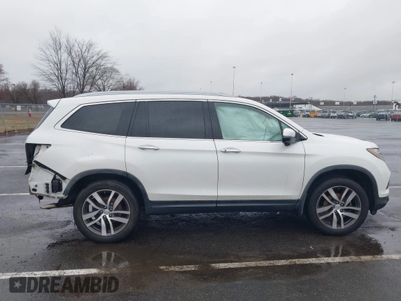 2016 Honda Pilot Touring with VIN 5FNYF6H95GB062089, listed as a IAAI auction lot 41810378 with 74,704 mi miles and . Bid and sale history available at DreamBid. Image 6.