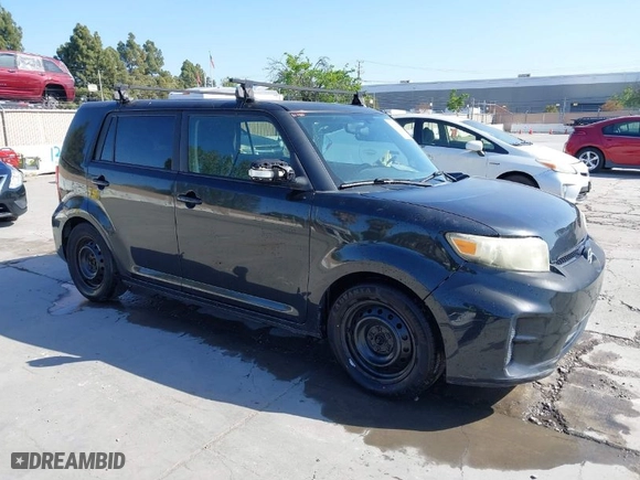 2012 Scion xB with VIN JTLZE4FE4C1143412, listed as a IAAI auction lot 42091929 with 213,501 mi miles. Bid and sale history available at carsss.com. Image 1.
