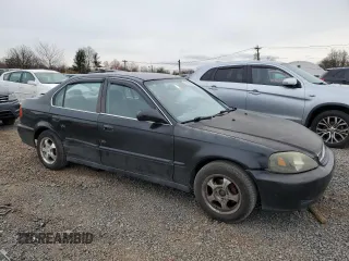 1999 Honda Civic LX with VIN 2HGEJ6677XH585273, listed as a Copart auction lot 51164635 with 184,874 mi miles and Salvage Title. Bid and sale history available at DreamBid. Image 4.