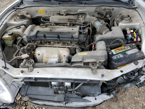 1999 Hyundai Tiburon with VIN KMHJG24F8XU126762, listed as a Copart auction lot 88747725 with 51,296 mi miles and Salvage Title. Bid and sale history available at carsss.com. Image 12.